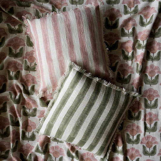 striped cushions on matching floral throw
