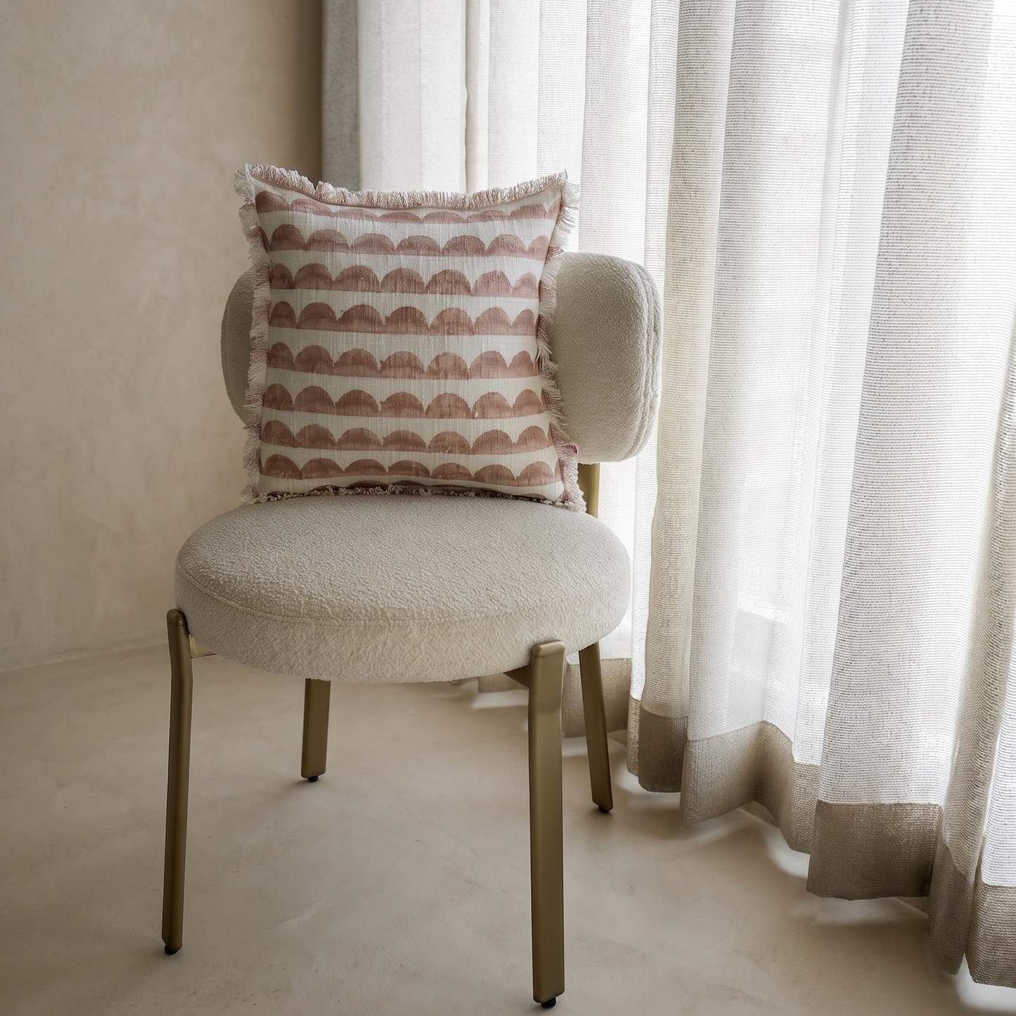 Block printed light Rust cushion with scalloped pattern